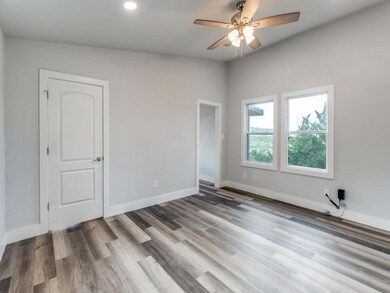 Spare room featuring wood finished floors, ceilin