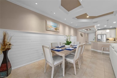 Dining space featuring light tile patterned floors