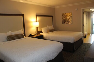 Tiled bedroom with crown molding