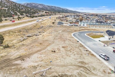 Aerial perspective of suburban area with a mountainous background