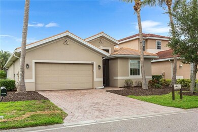 View of front of house with stucco siding, a garage, decorative driveway, and a tile roof