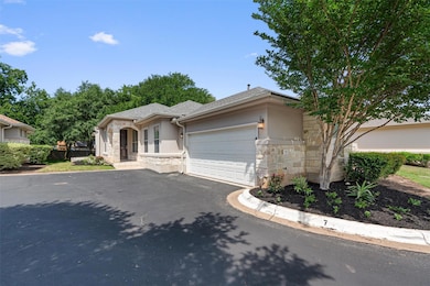 View of front of property with stone siding, stuc