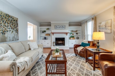 The living room has plenty of space for your personal furnishings and decor.