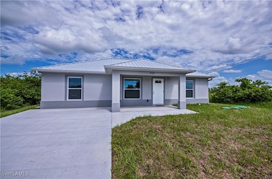 View of front of property with stucco siding, a fr