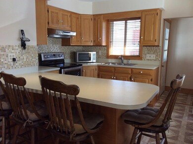 VIEW FROM DINING AREA / BAR WITH STOOLS