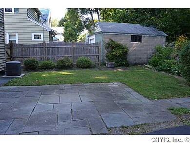 Backyard. Stone patio located at the rear of the h