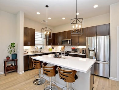 Kitchen featuring appliances with stainless steel