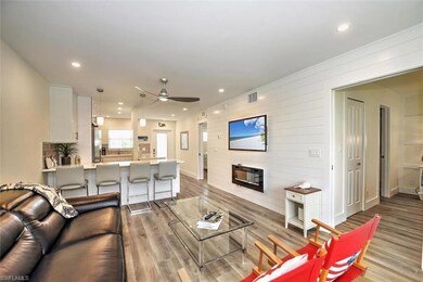 Living room featuring fireplace, recessed lighting