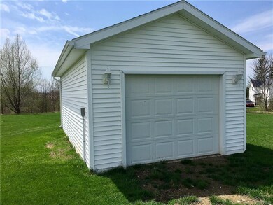 Additional detached 1 car garage equipped with pow