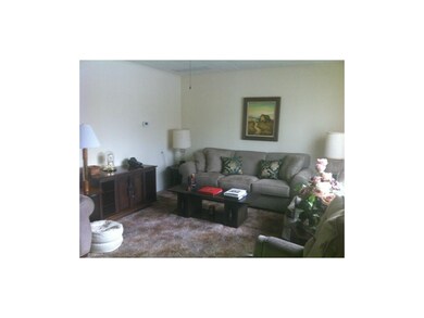 Inviting Living room is carpeted.