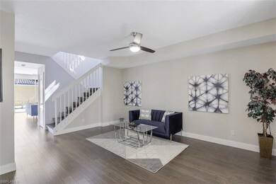 Front entryway view of front living room. Stairs a