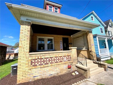 The covered front porch is the ideal spot to greet