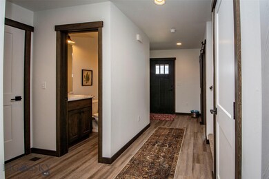 Entry Hall looking towards 1/2 bath and garage door