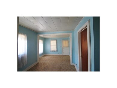 Living Room. Nice size living room, white door lea