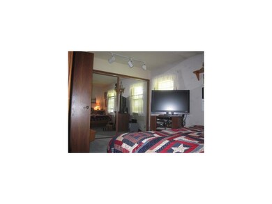 Bedroom. Large mirrored closet on one end of maste