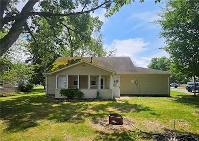 Side angle view of the house, showcasing the yard