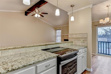 Kitchen with light wood-style floors, decorative b