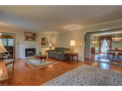 Living room with one of three fireplaces.