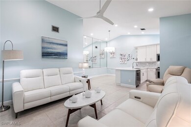 Living room featuring a ceiling fan, baseboards, r