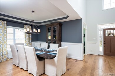 Formal Dining Room with Custom Wainscoting and Tra