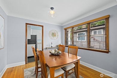 Hardwood floors extend into the dining room.