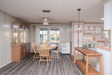 Dining room with dark hardwood / wood-style floori