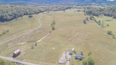to the Left of the County Road is 19.3 acres on the right is the 39.22 Acres 