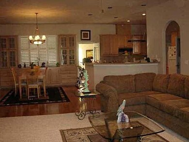 Living area with arched walkways and an inviting 
