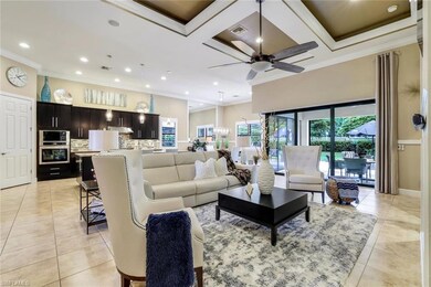 Living room featuring coffered ceiling with up to 
