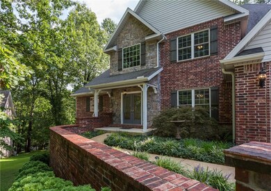 Brick and Stone Elevation w/Professional Landscaping and Double Front Door Entry !!