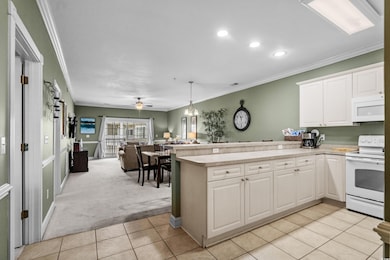 Kitchen featuring white appliances, ornamental mol