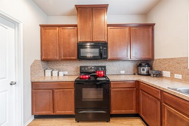 Spacious kitchen with ample counter space and slee