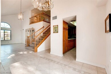 Loft Above Living Room With Custom Built-ins.