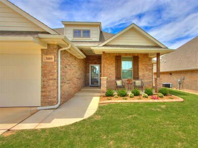 View of front of house featuring a front yard, a g