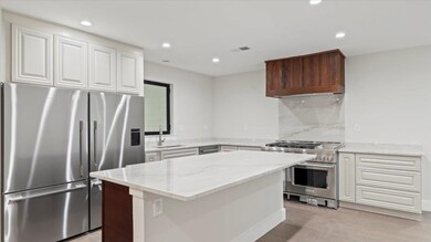 Kitchen with light hardwood / wood-style flooring,
