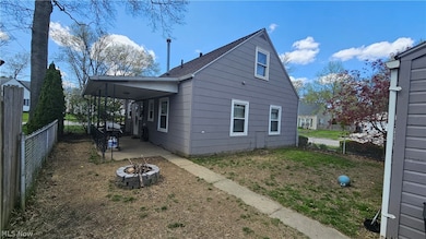 view of house and patio from behind the garage