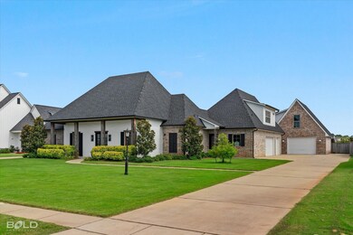 French country style house featuring a garage and 