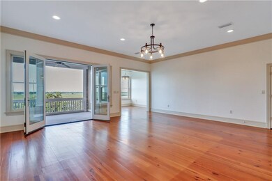 French doors to screened porch overlooking the Dar