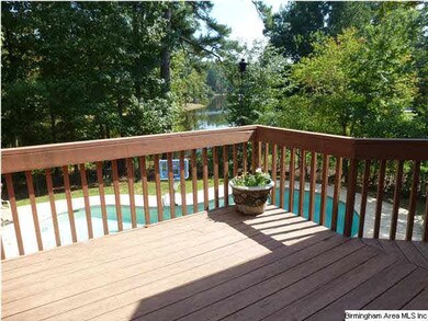 OPEN DECK OVERLOOKING THE POOL & LAKE.