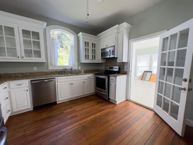 KITCHEN LOOKING TOWARDS SUNROOM