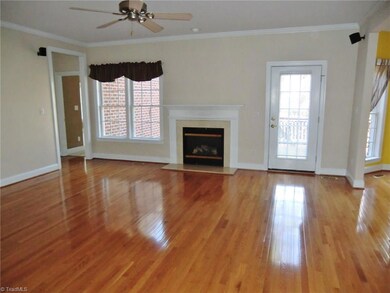 Great Room with a gas log fireplace and a French door leading out to the deck with a hot tub that is negotiable.