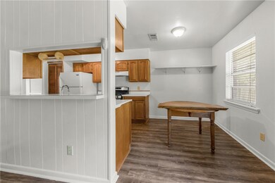 Kitchen featuring freestanding refrigerator, gas s