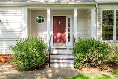 View of exterior entry featuring a porch