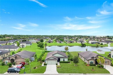 Aerial perspective of suburban area featuring a large body of water