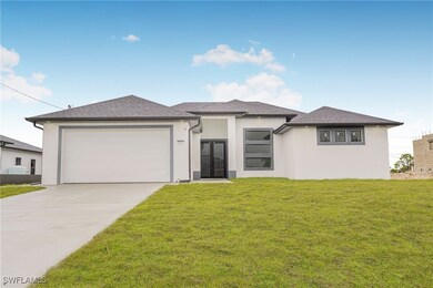 Prairie-style house with stucco siding, driveway,