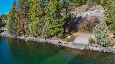 Aerial view of property's location featuring a nearby body of water