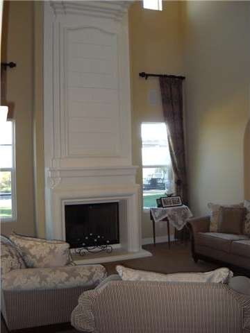 Formal Living with dramatic ceilings and fireplace