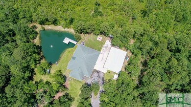 Aerial view of the property. Main house next to th