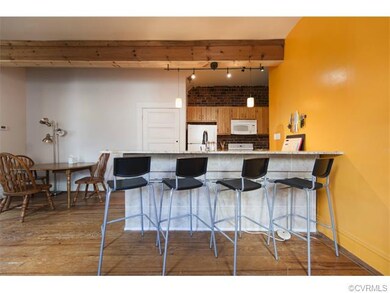 The kitchen has a tiled bar with raised counter, p