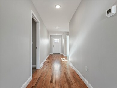 EXTRA WIDE HALLWAY TO THE FRONT DOOR.